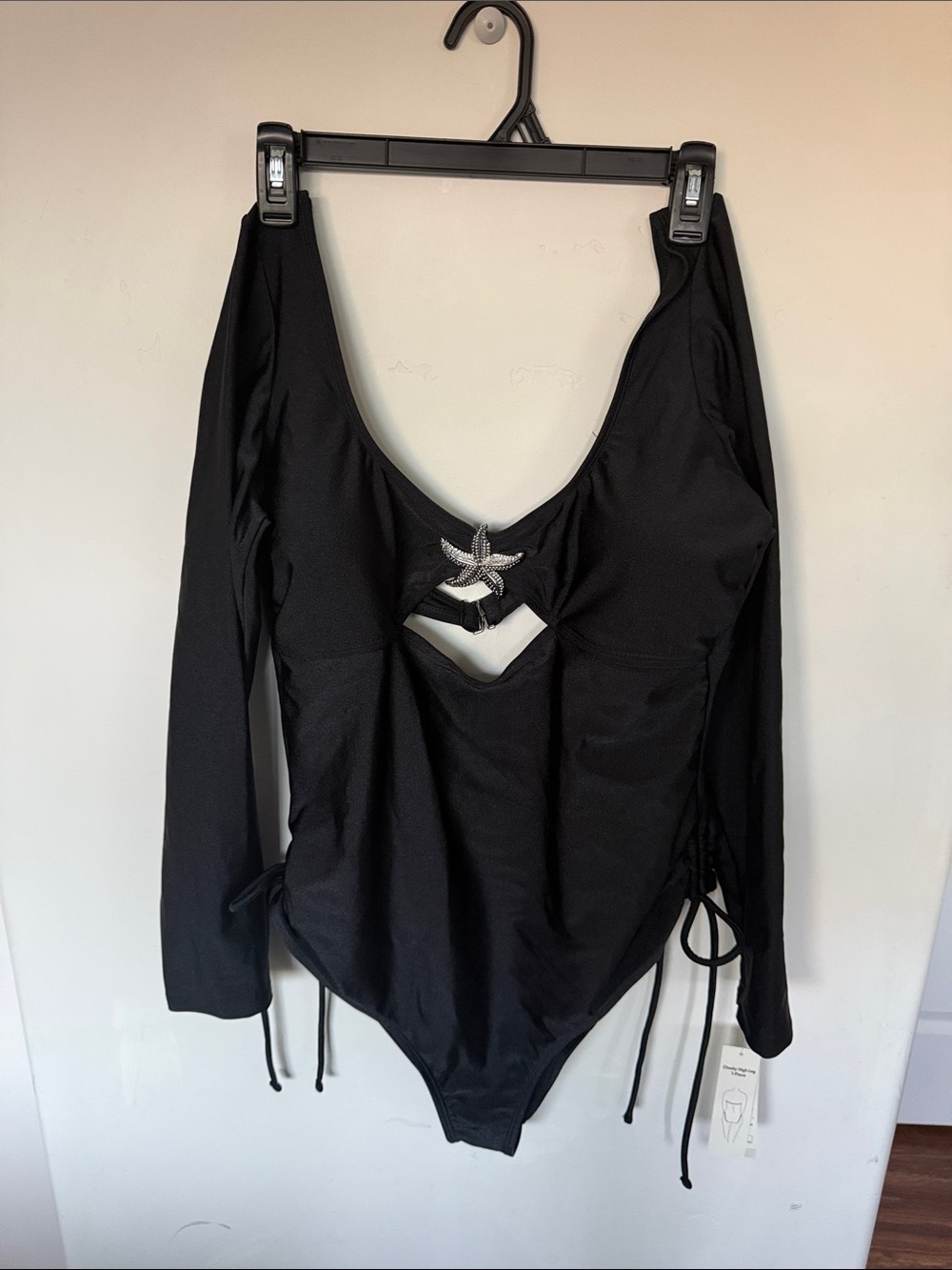 Black Long-Sleeve women’s One-Piece Swimsuit with Star Accent